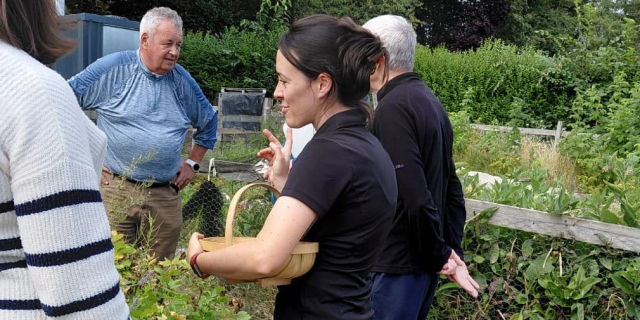 group of 4 people around a raised bed