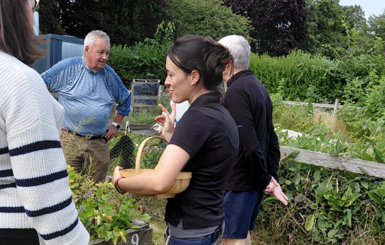 group of 4 people around a raised bed