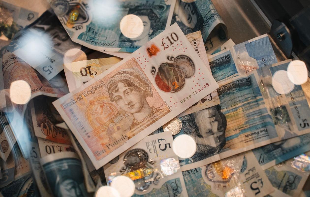 UK Bank notes spread out on a table  