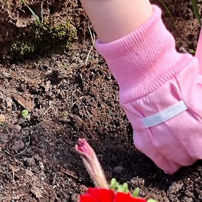 child's hands gardening 