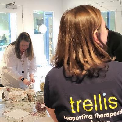 small group making herb bags at a table